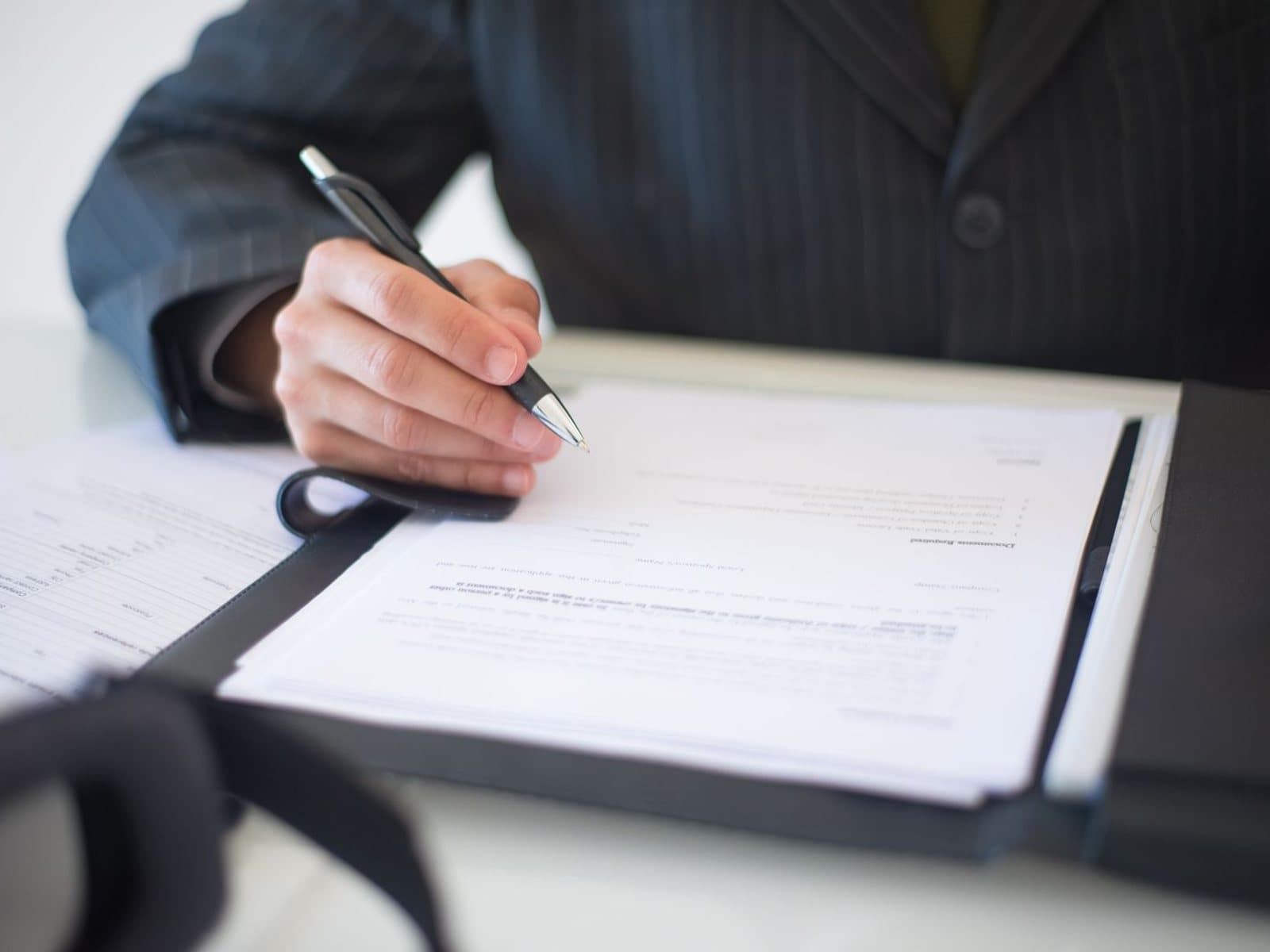 Import documents being reviewed at an office table